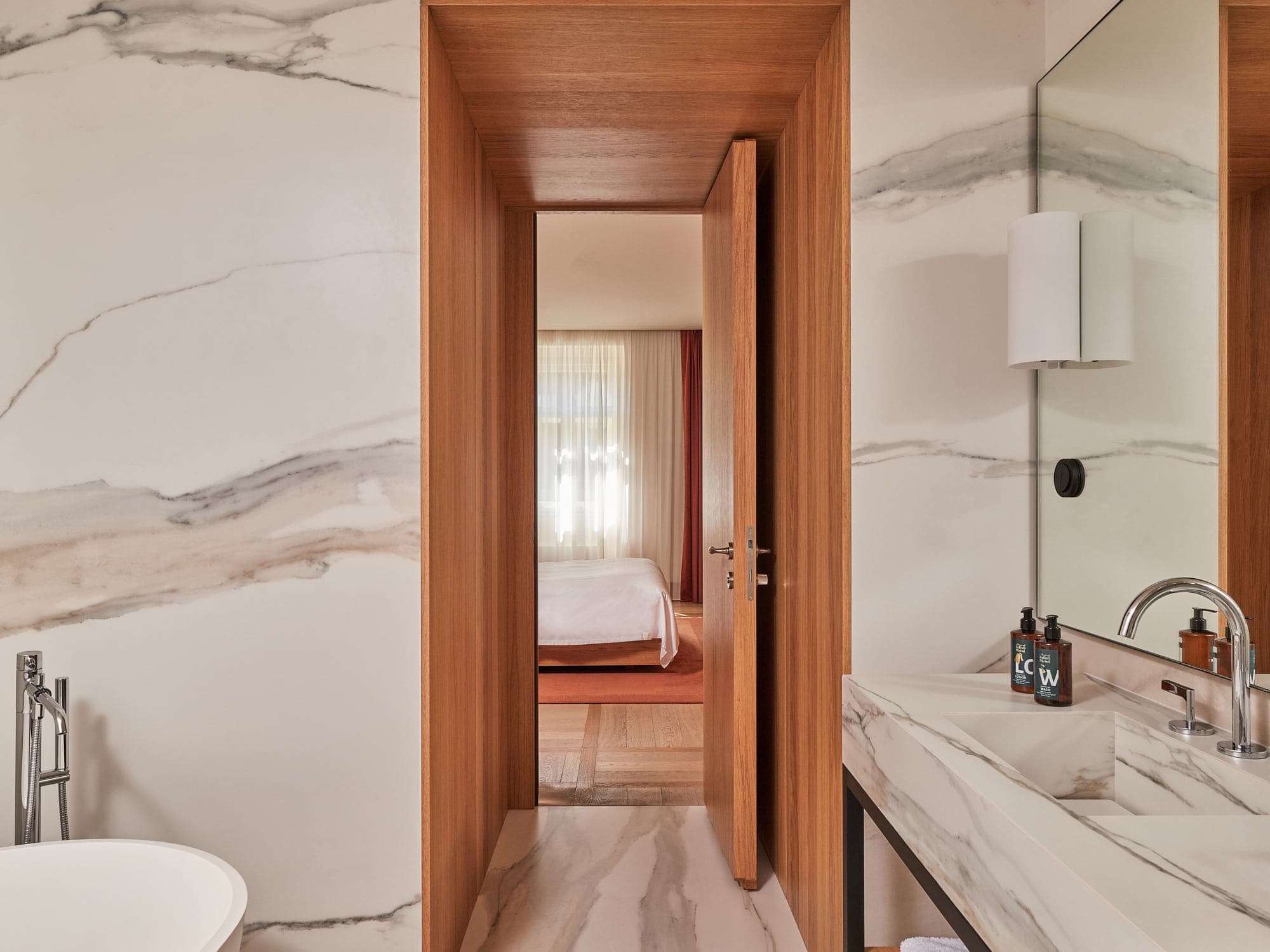 Marble bathroom of a Deluxe One Bedroom Suite